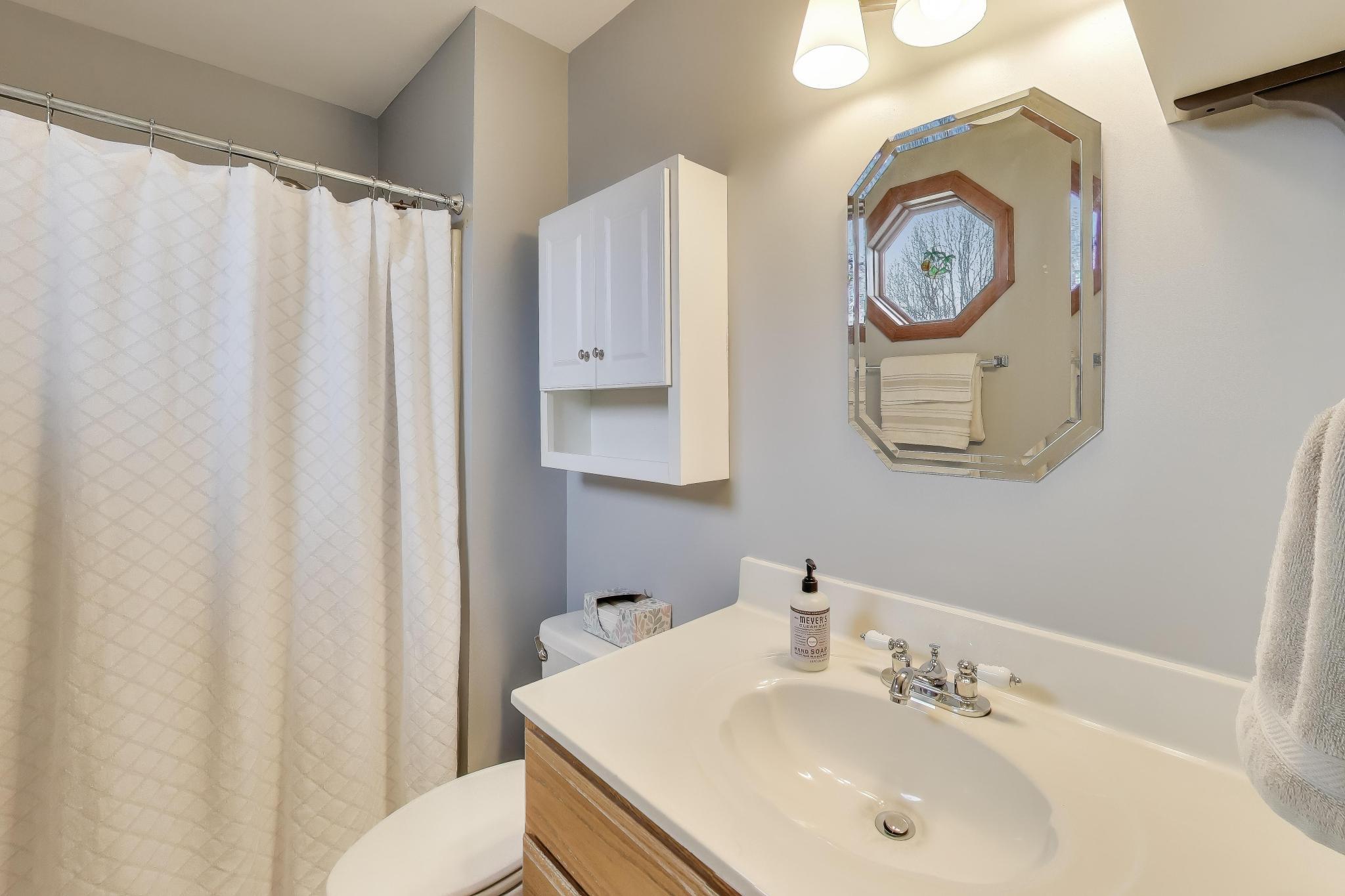 6926 Hawk Drive Schererville, IN 46375 - Photo 20 of 44 a bathroom with a sink and a mirror