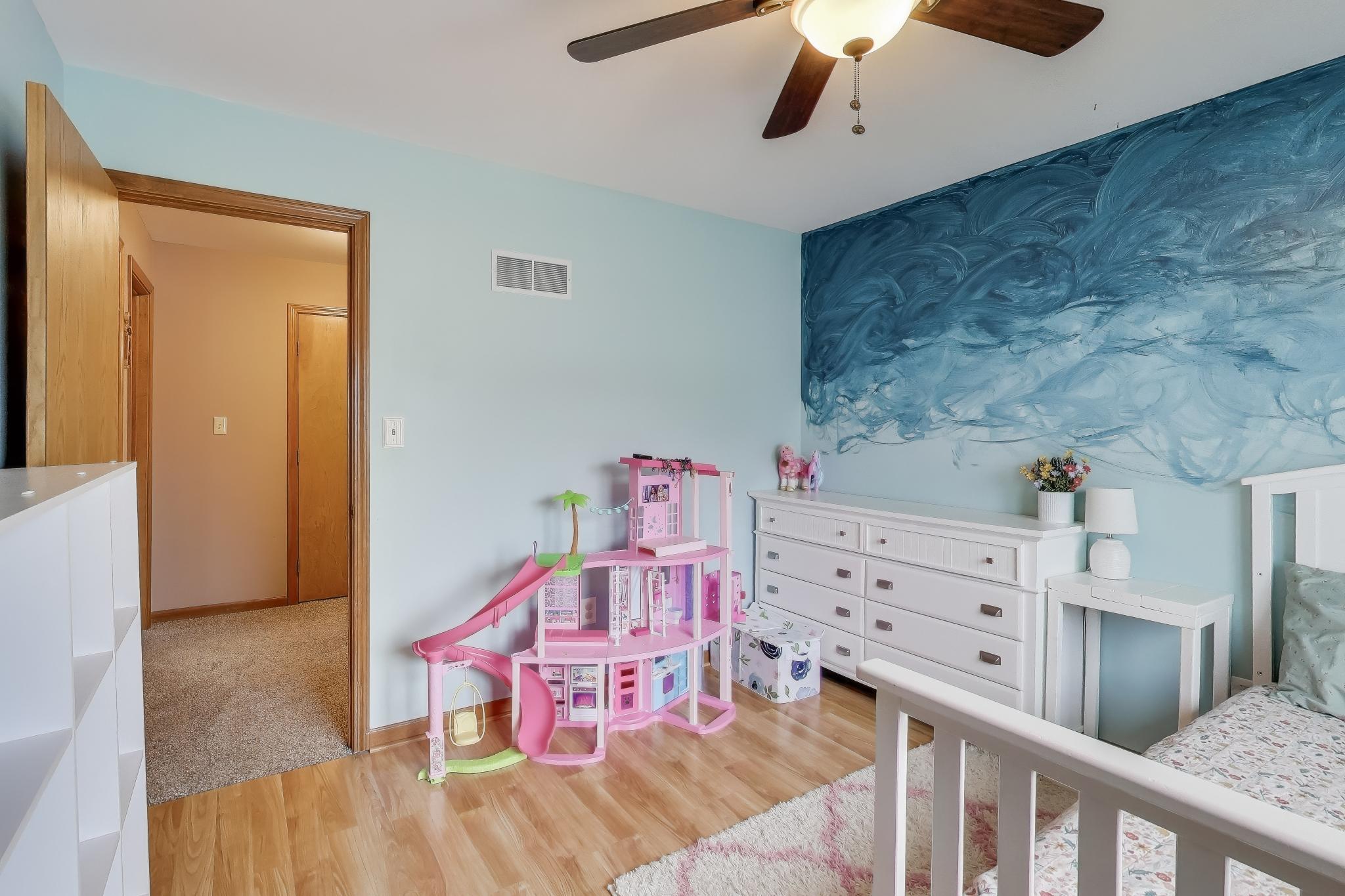 6926 Hawk Drive Schererville, IN 46375 - Photo 22 of 44 a bedroom with furniture and baby crib
