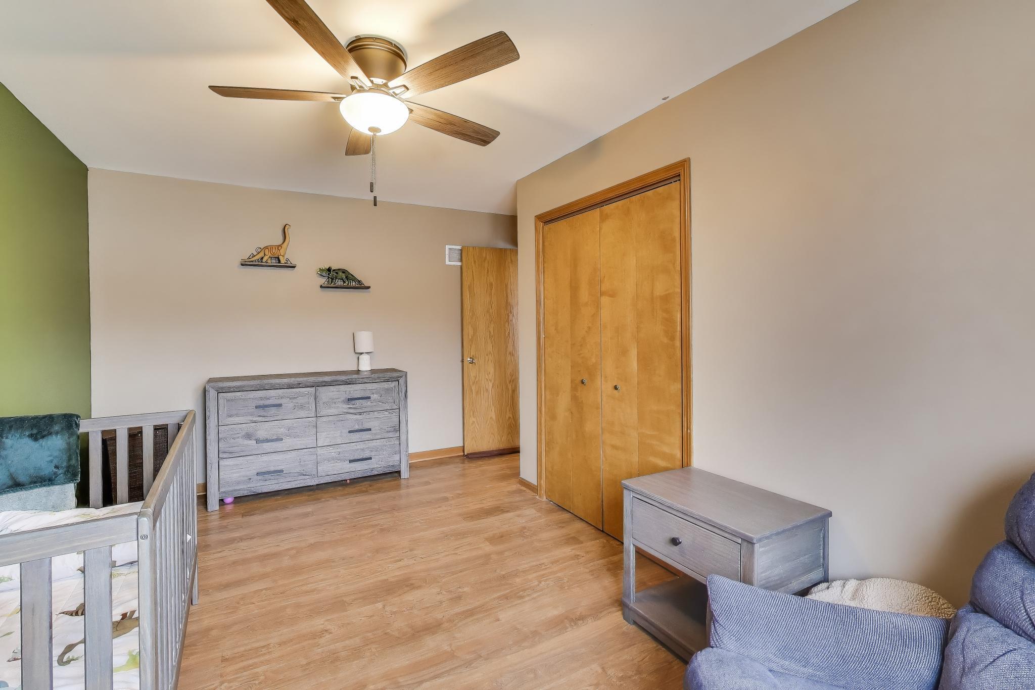 6926 Hawk Drive Schererville, IN 46375 - Photo 24 of 44 a view of a bedroom with furniture and natural light