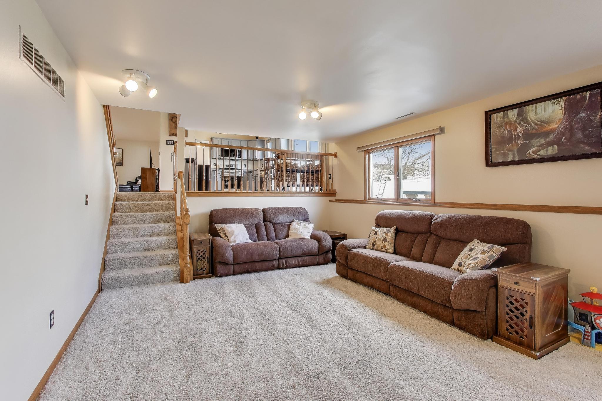 6926 Hawk Drive Schererville, IN 46375 - Photo 28 of 44 a living room with furniture and a wooden floor