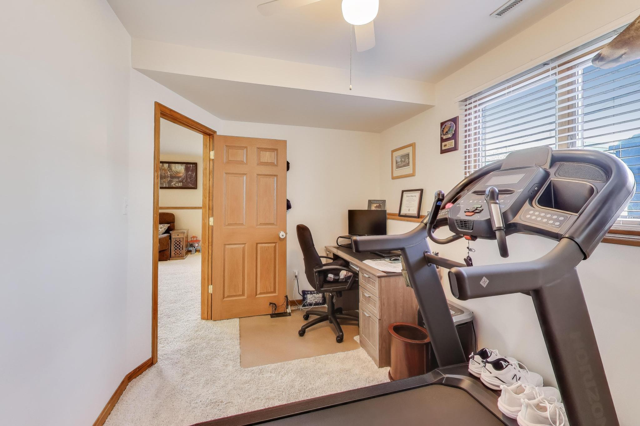 6926 Hawk Drive Schererville, IN 46375 - Photo 30 of 44 a view of a workspace with furniture and a window