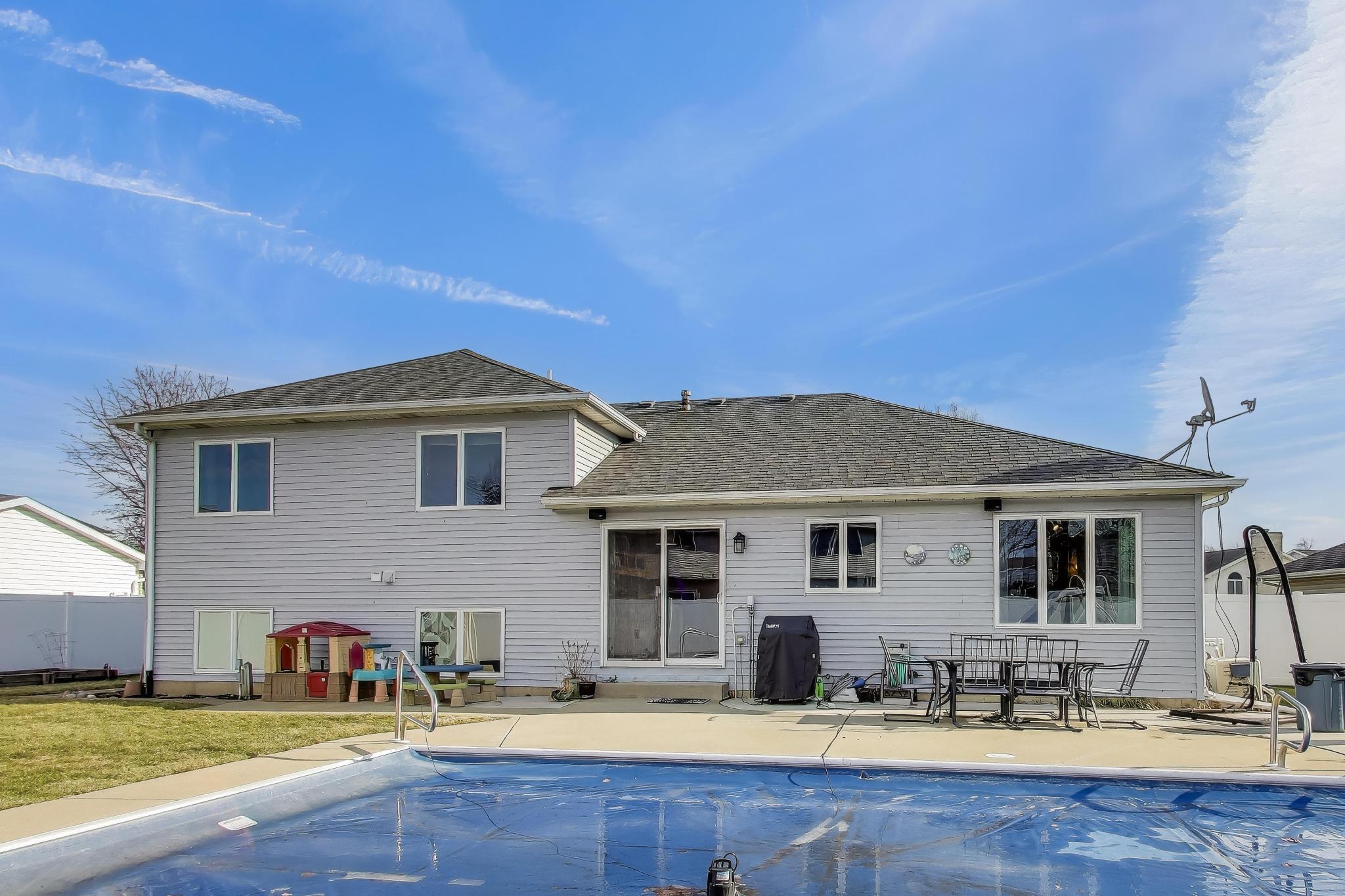 6926 Hawk Drive Schererville, IN 46375 - Photo 33 of 44 a front view of a house with garden and patio