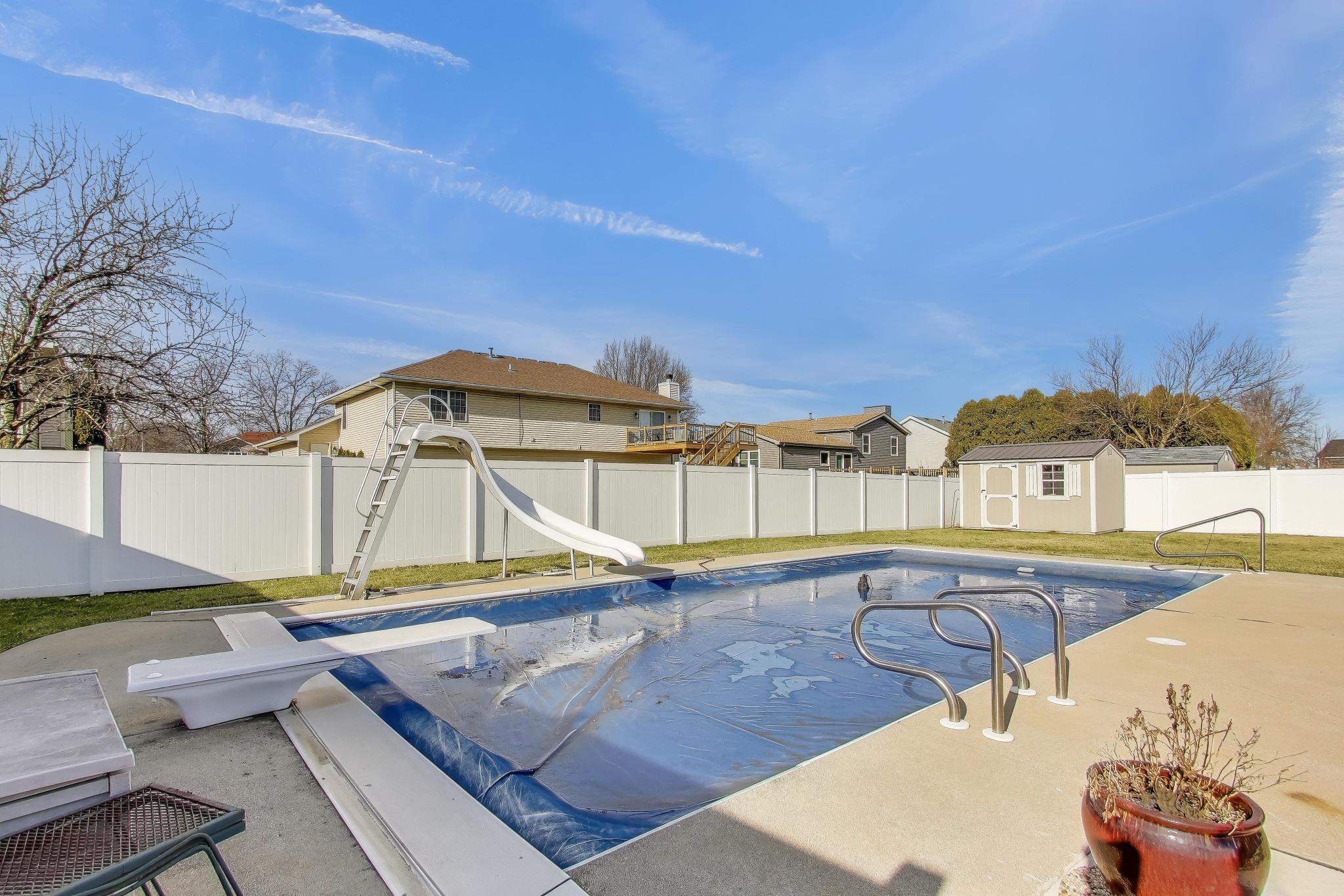 6926 Hawk Drive Schererville, IN 46375 - Photo 39 of 44 a view of a swimming pool with a lounge chairs