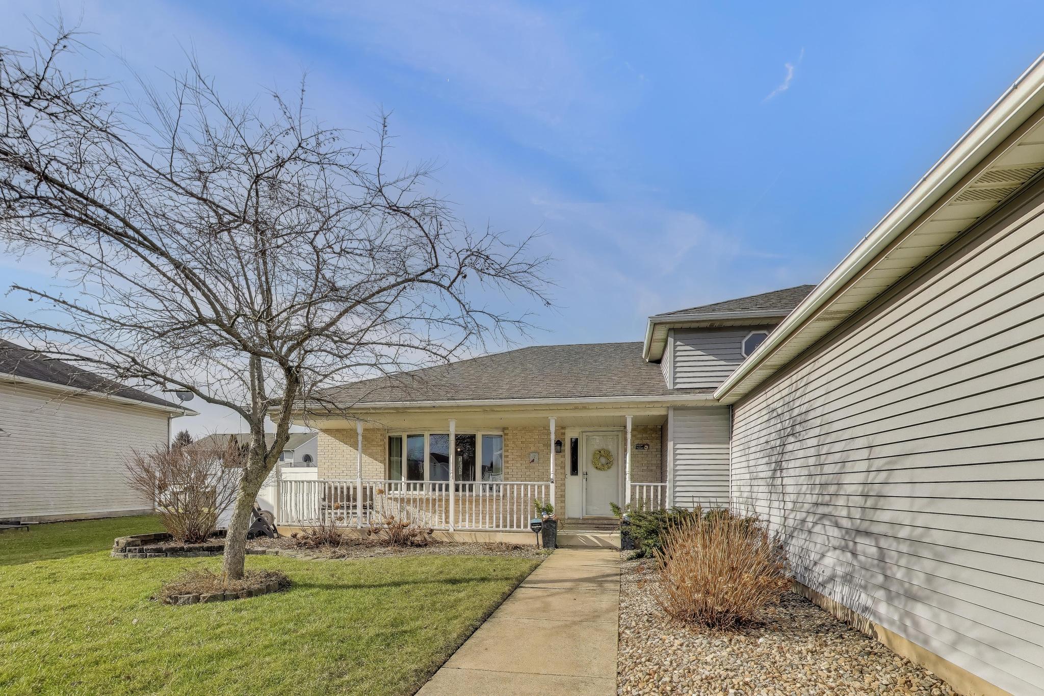 6926 Hawk Drive Schererville, IN 46375 - Photo 4 of 44 a front view of a house with garden