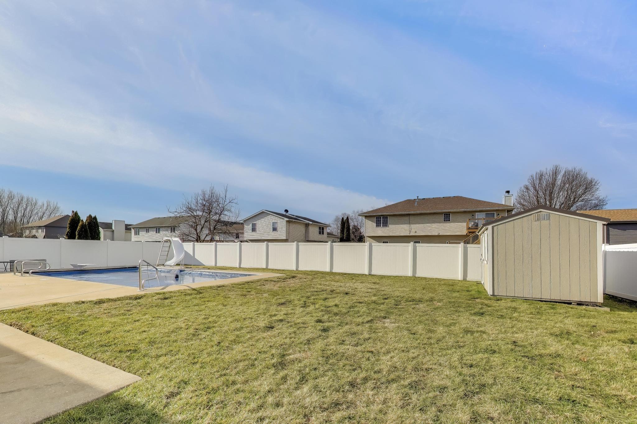 6926 Hawk Drive Schererville, IN 46375 - Photo 41 of 44 a swimming pool with outdoor seating and yard