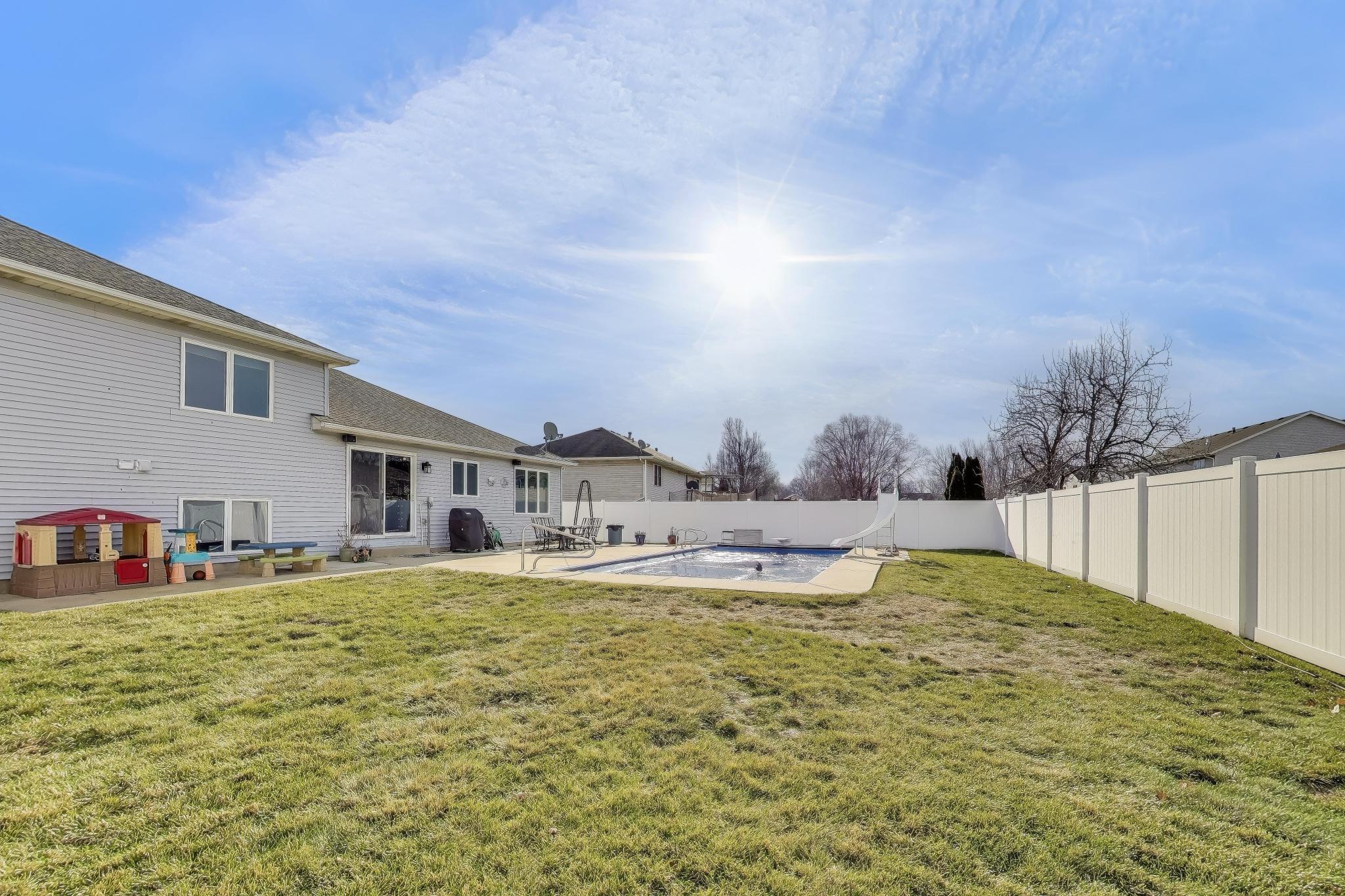 6926 Hawk Drive Schererville, IN 46375 - Photo 42 of 44 a view of a house with swimming pool and a yard