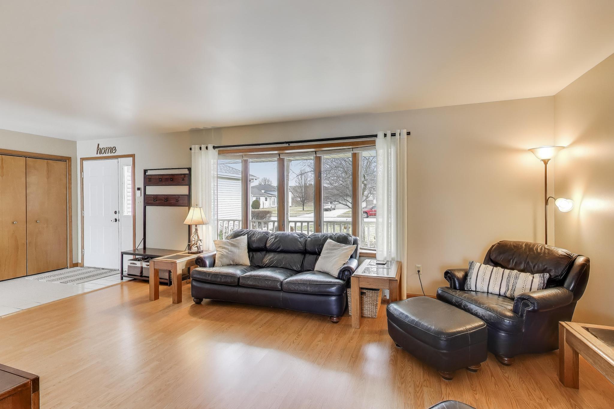 6926 Hawk Drive Schererville, IN 46375 - Photo 7 of 44 a living room with furniture and a large window