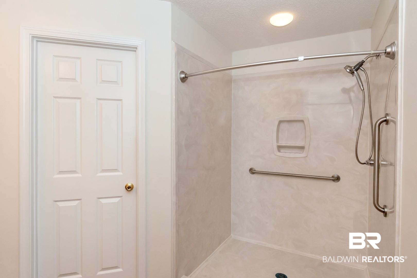 672 Spring Lake Drive East Mobile, AL 36695 - Photo 15 of 26 Bathroom featuring a shower and a textured ceiling