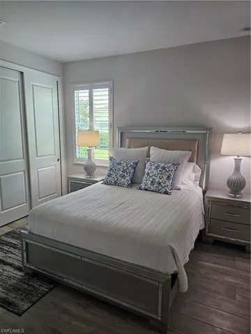 a white toilet sitting next to a bath tub and shower