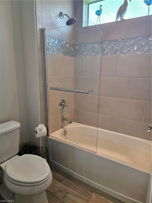 9022 Redonda Drive Naples, FL 34114 - Photo 15 of 28 a white toilet sitting next to a bath tub and shower