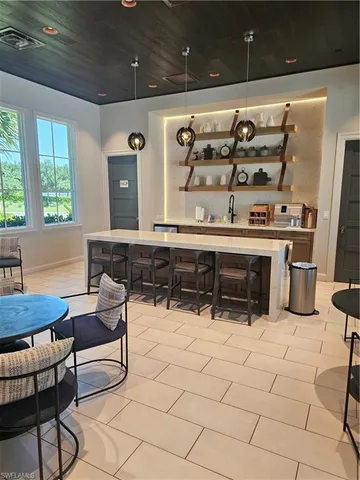 a view of a house with garden and sitting area