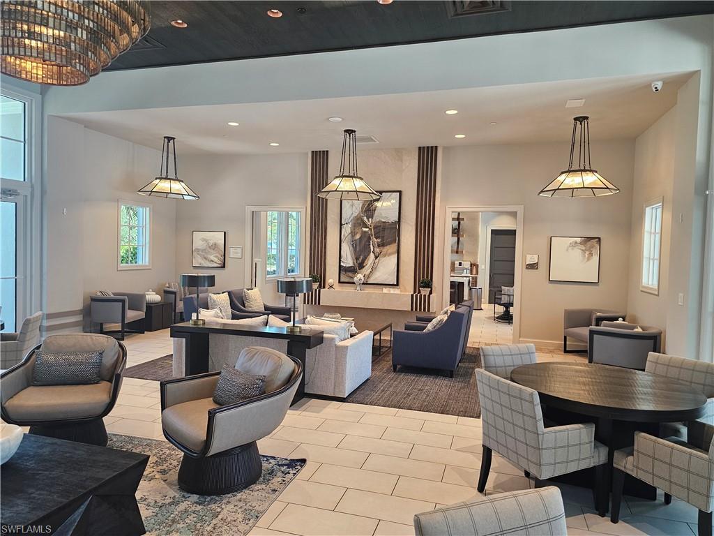 9022 Redonda Drive Naples, FL 34114 - Photo 27 of 28 a living room with lots of furniture and view of kitchen