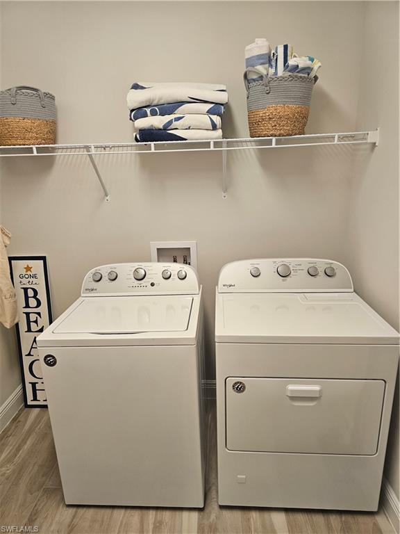 9022 Redonda Drive Naples, FL 34114 - Photo 7 of 28 a utility room with dryer and washer