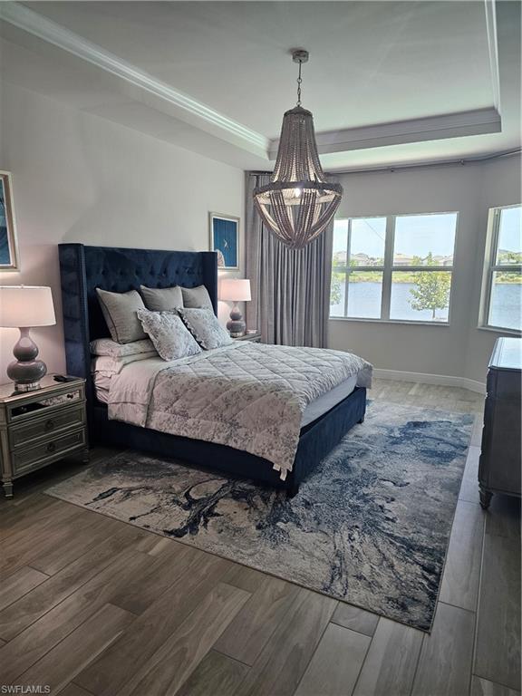 9022 Redonda Drive Naples, FL 34114 - Photo 9 of 28 a bedroom with a bed and a window