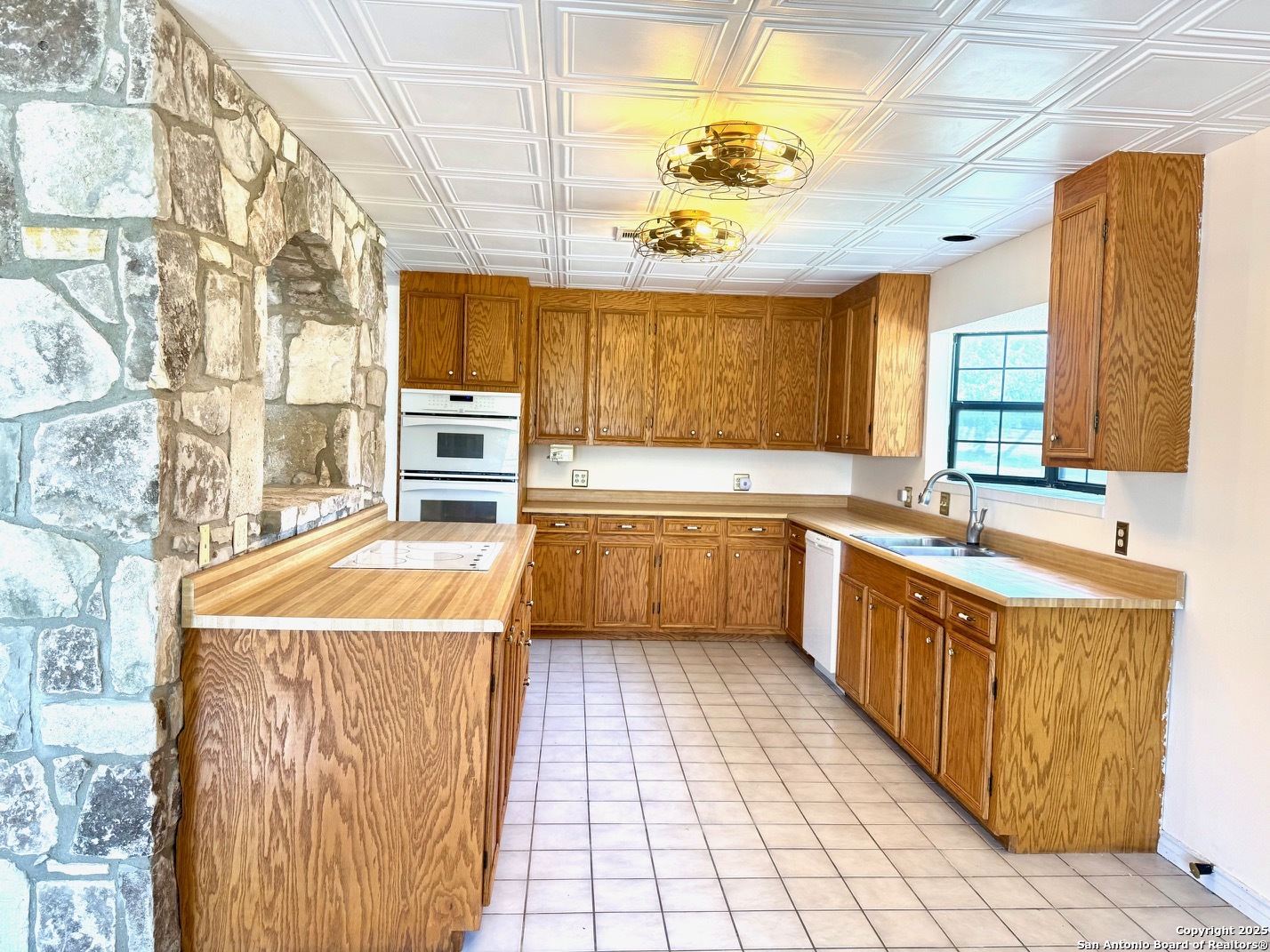 181 Leinweber Drive Leakey, TX 78873 - Photo 11 of 56 a kitchen with a sink a counter top space and appliances