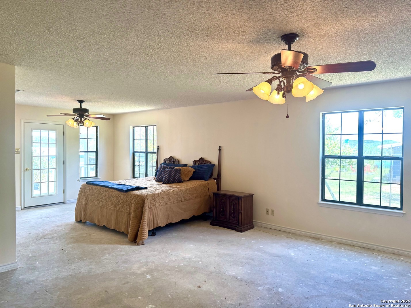 181 Leinweber Drive Leakey, TX 78873 - Photo 15 of 56 a living room with furniture chandelier and window