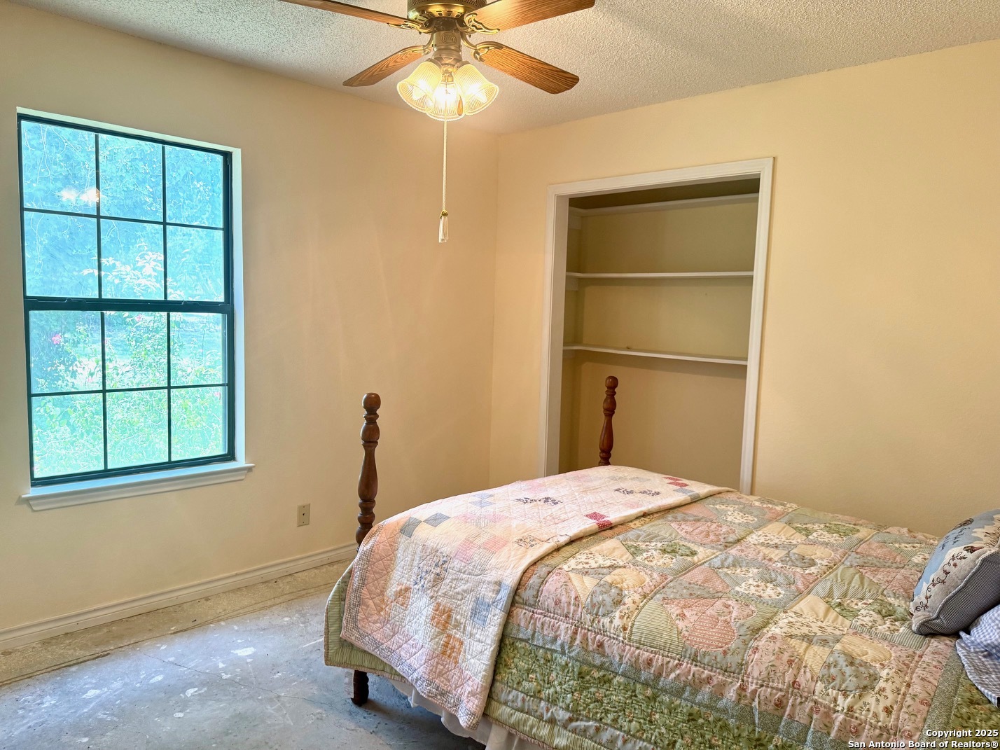181 Leinweber Drive Leakey, TX 78873 - Photo 20 of 56 a bedroom with a bed and a window