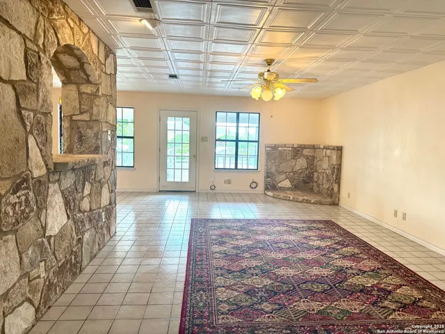 a white toilet sitting next to a bath tub
