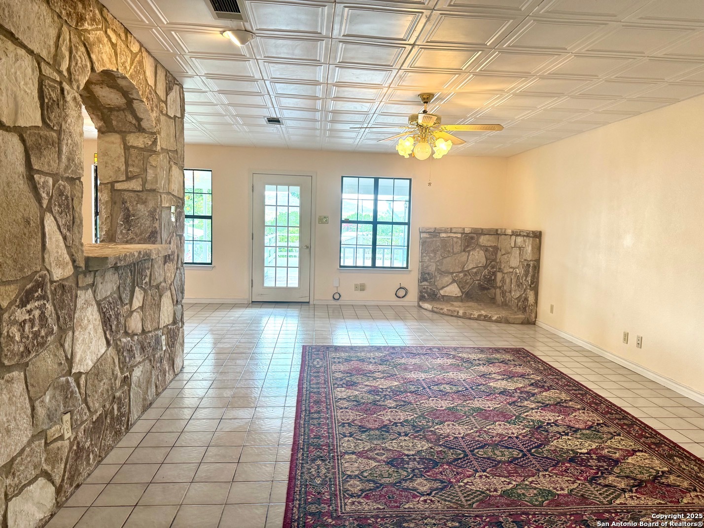 181 Leinweber Drive Leakey, TX 78873 - Photo 23 of 56 a view of hallway with chandelier and glass door