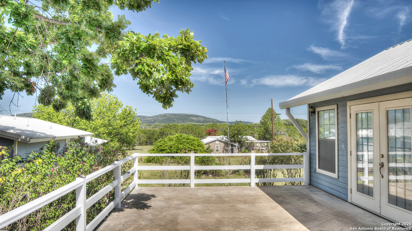 181 Leinweber Drive Leakey, TX 78873 - Photo 27 of 56 a view of a porch with a bench in front of it