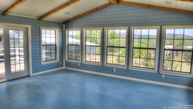 an empty room with windows