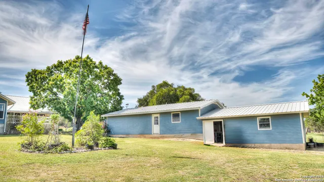a living room with furniture a dining table and chairs