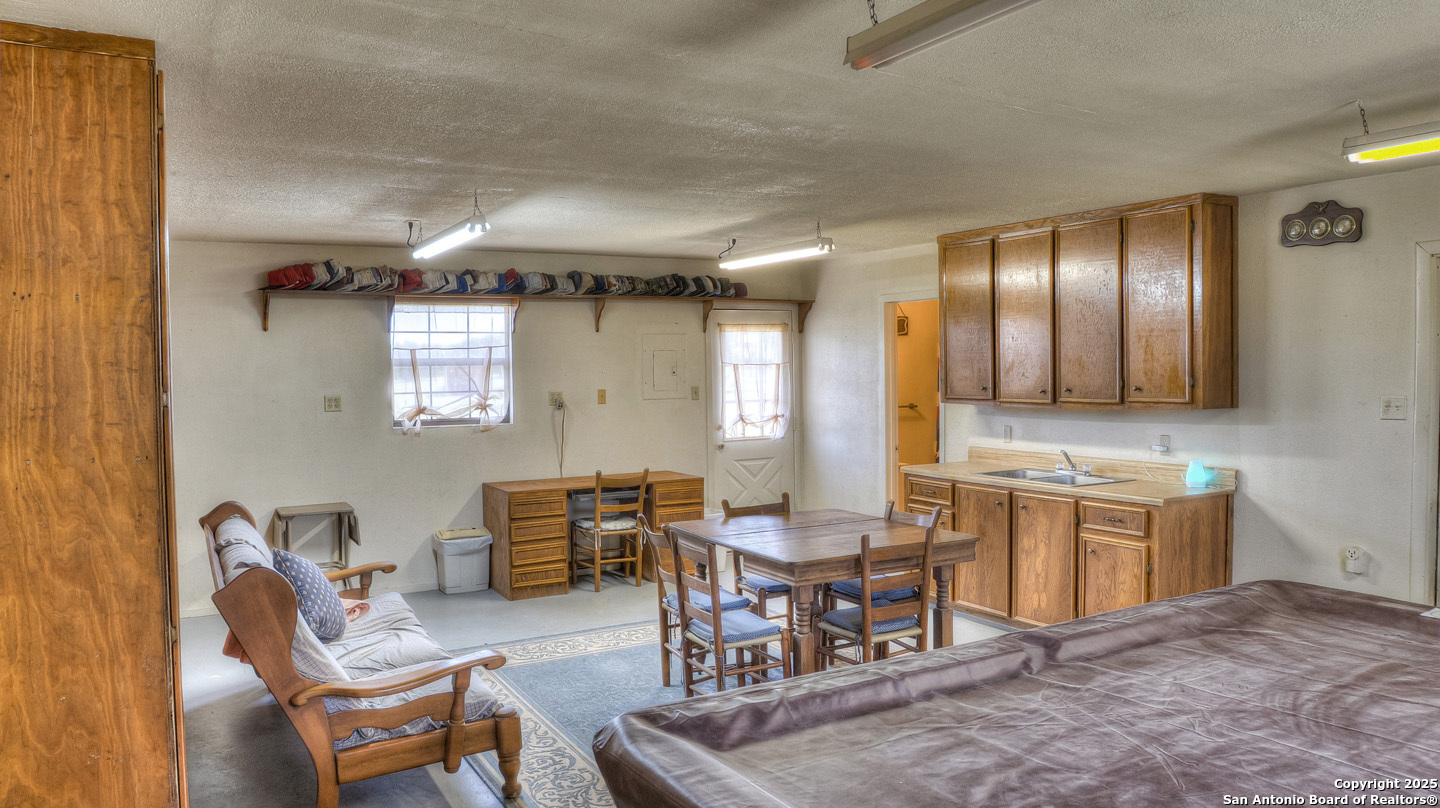 181 Leinweber Drive Leakey, TX 78873 - Photo 37 of 56 a living room with furniture a dining table and chairs