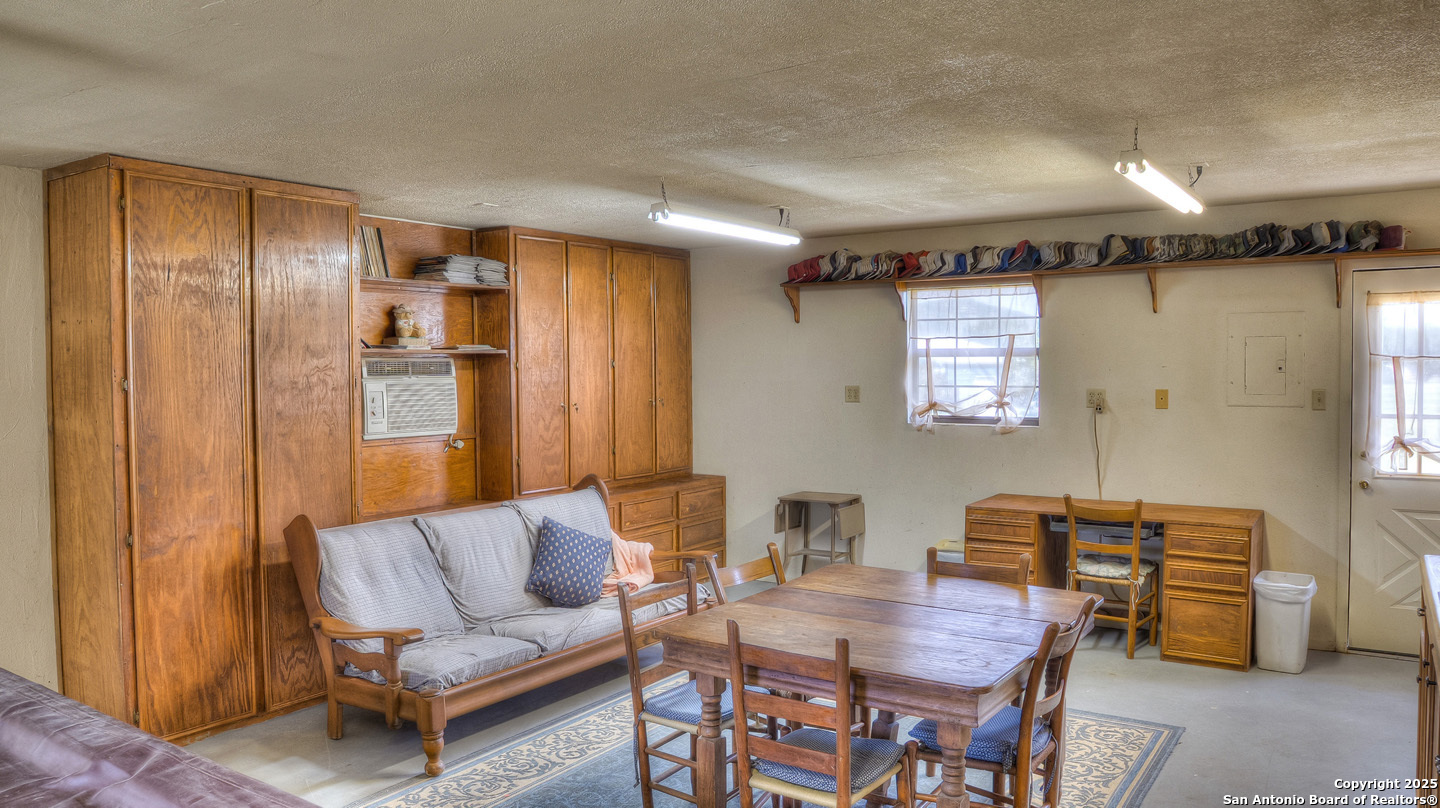 181 Leinweber Drive Leakey, TX 78873 - Photo 38 of 56 a living room with furniture and a window