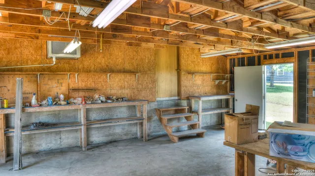 an aerial view of residential house with green space