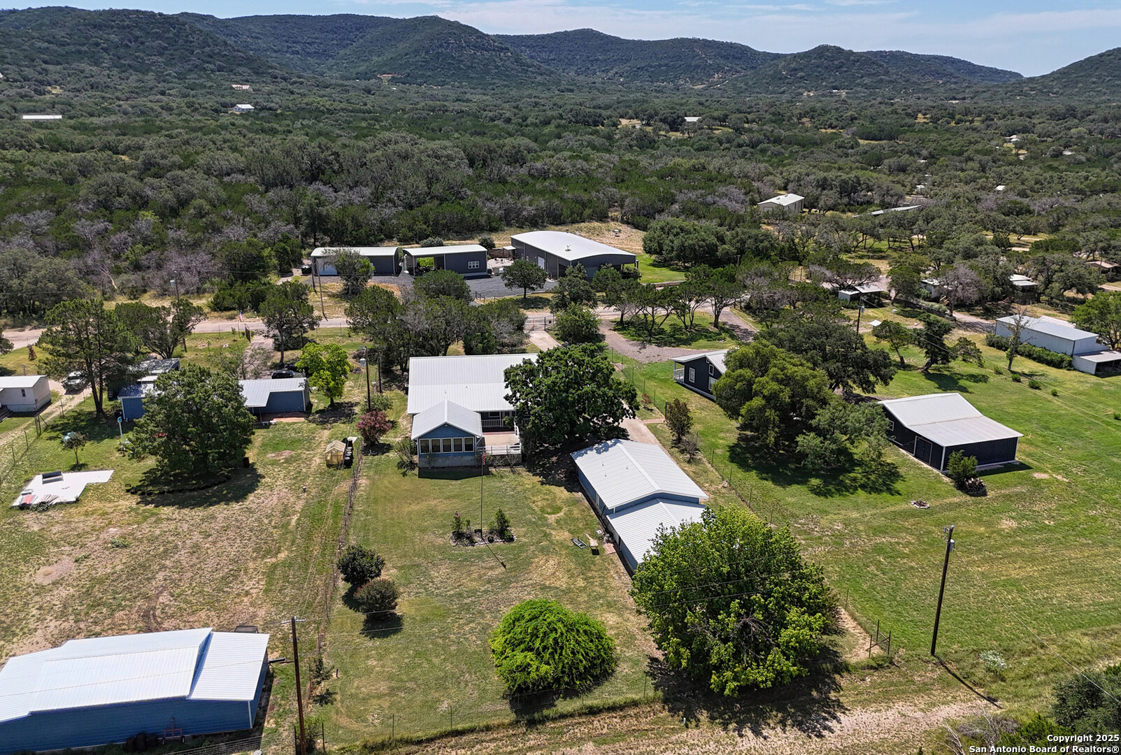181 Leinweber Drive Leakey, TX 78873 - Photo 45 of 56 an aerial view of residential house with green space