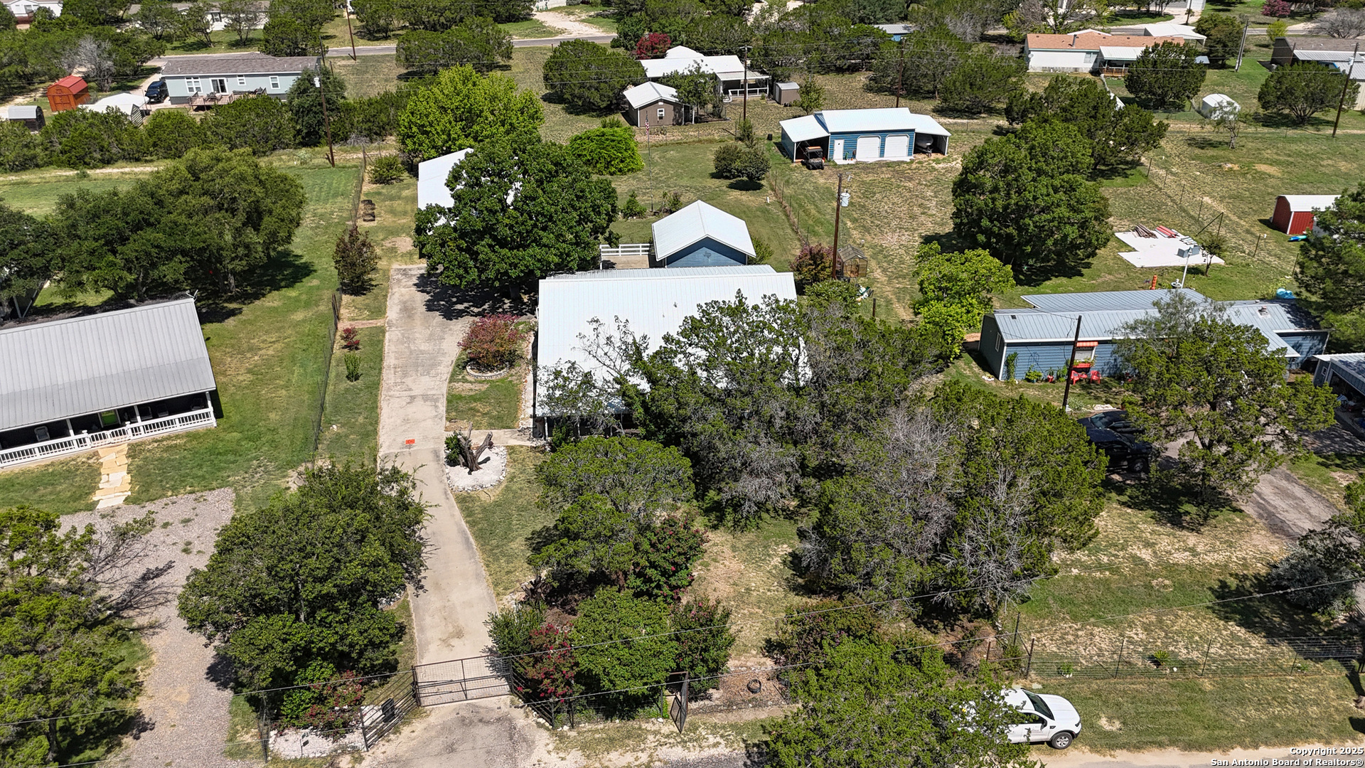 181 Leinweber Drive Leakey, TX 78873 - Photo 46 of 56 an aerial view of multiple houses with yard