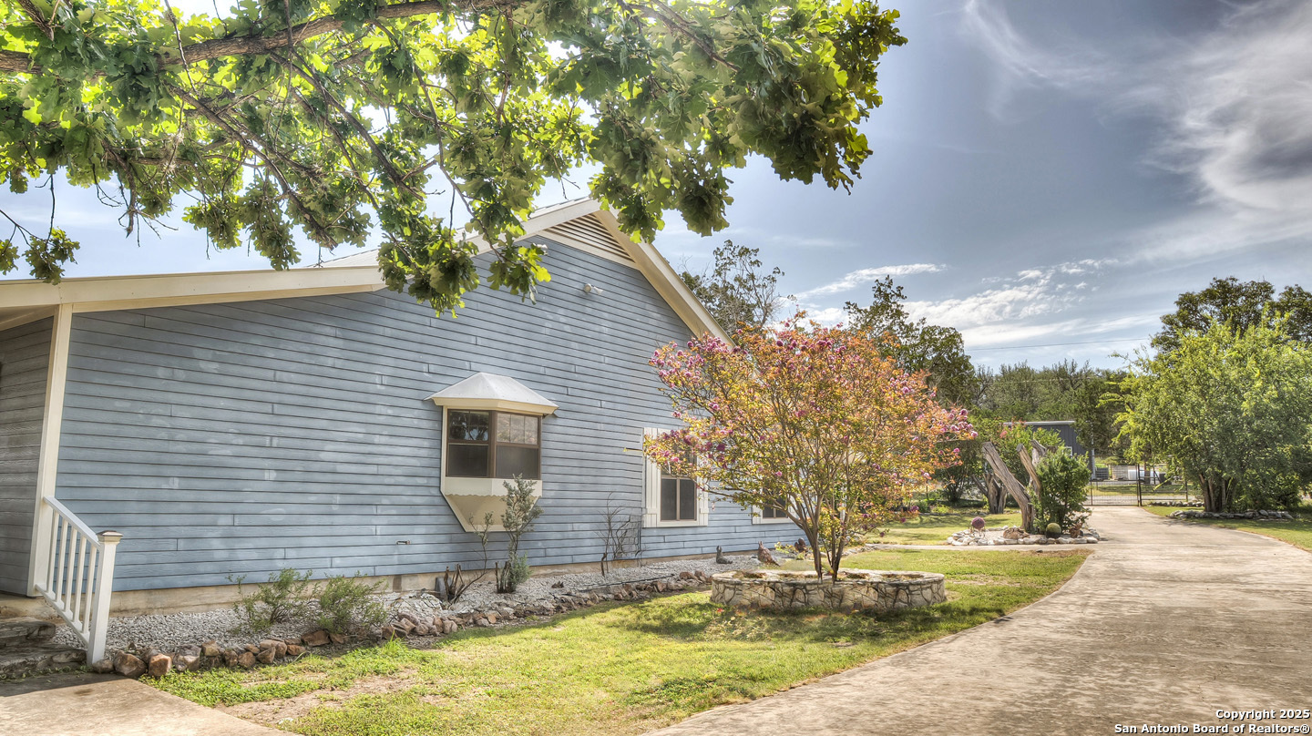 181 Leinweber Drive Leakey, TX 78873 - Photo 6 of 56 a front view of a house with a yard