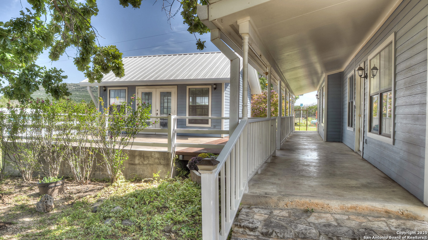 181 Leinweber Drive Leakey, TX 78873 - Photo 7 of 56 a view of a house with backyard and porch