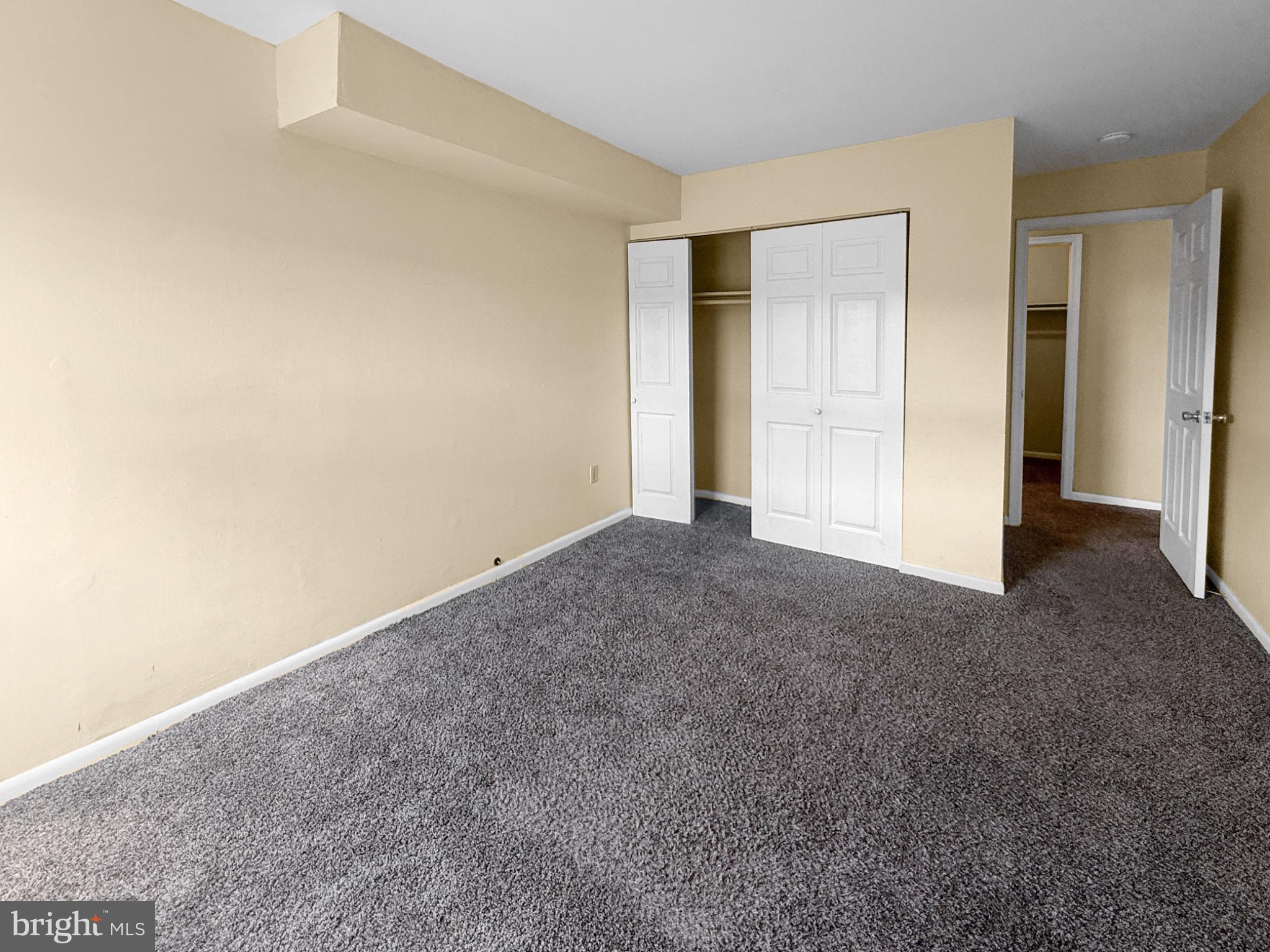 3807 St Barnabas Road, Unit 203 Suitland, MD 20746 - Photo 19 of 23 Spacious room with neutral tones.