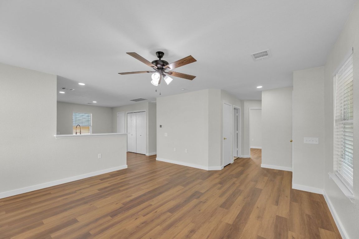 11617 Briarcreek Loop Manor, TX 78653 - Photo 2 of 37 Unfurnished room with recessed lighting, wood finished floors, and ceiling fan
