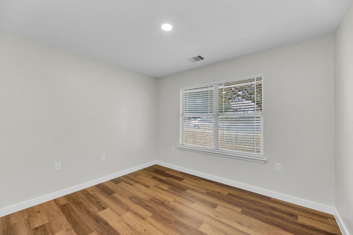 11617 Briarcreek Loop Manor, TX 78653 - Photo 26 of 37 Unfurnished room with wood finished floors and recessed lighting