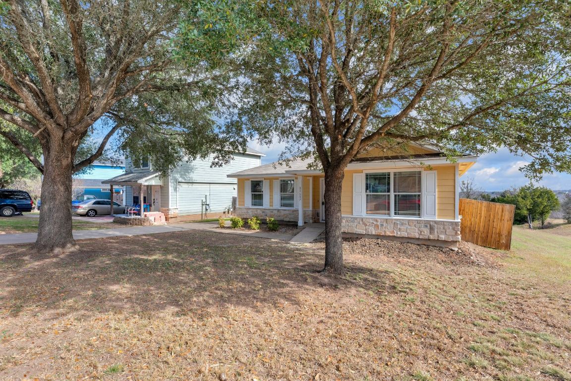 11617 Briarcreek Loop Manor, TX 78653 - Photo 36 of 37 View of front facade with stone siding and a front yard