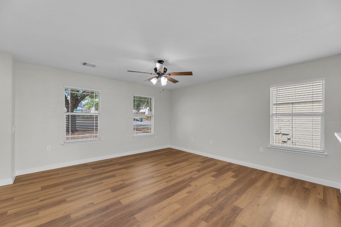 11617 Briarcreek Loop Manor, TX 78653 - Photo 6 of 37 Spare room featuring wood finished floors and a ceiling fan