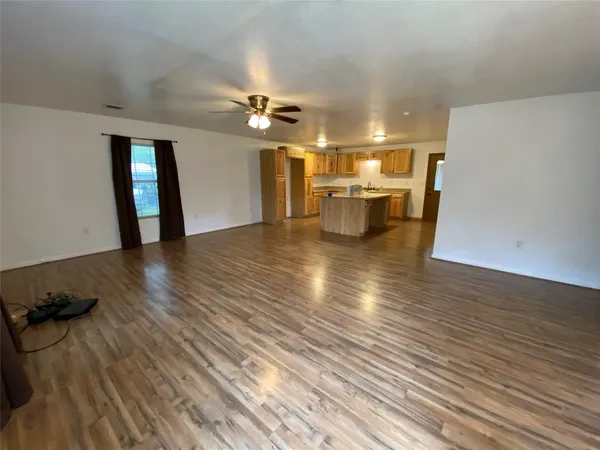 a view of a livingroom with wooden floor