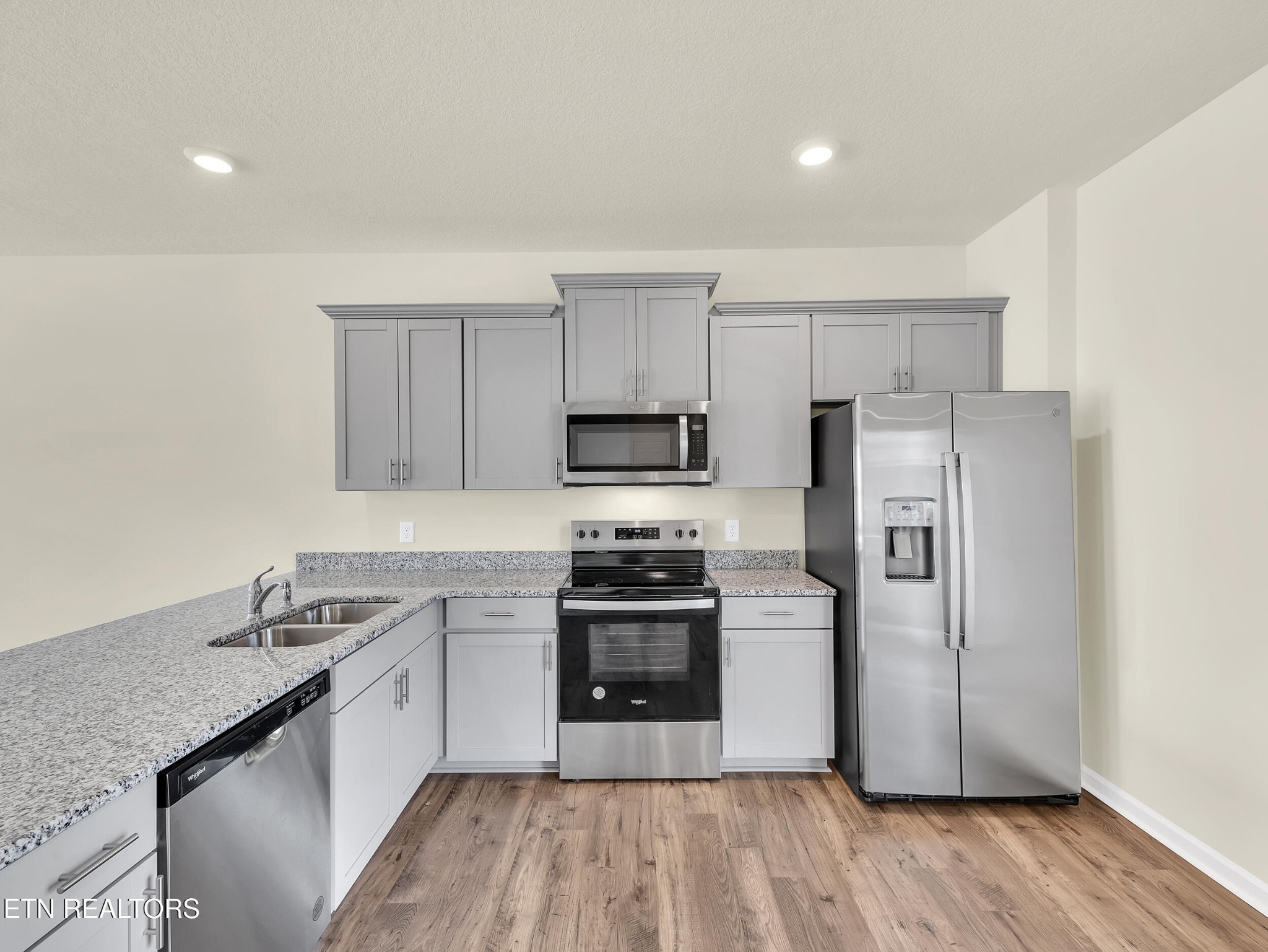 3521 Rylee Jean Way Maryville, TN 37804 - Photo 7 of 20 a kitchen with stainless steel appliances granite countertop a stove a sink and a refrigerator