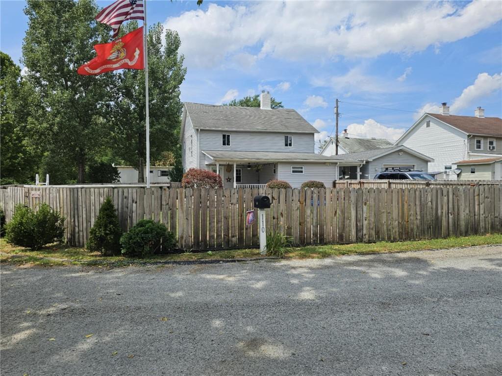 110 Post Road Uniontown, PA 15401 - Photo 1 of 17 a front view of a house with a yard