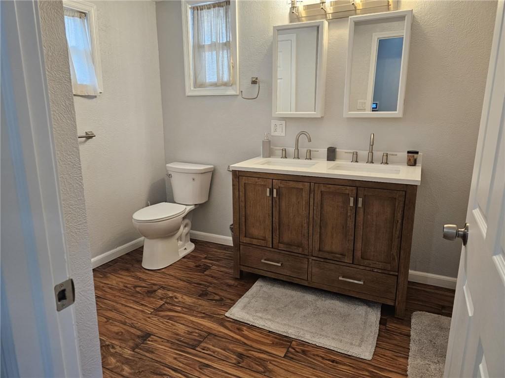 110 Post Road Uniontown, PA 15401 - Photo 8 of 17 a bathroom with a sink toilet and mirror