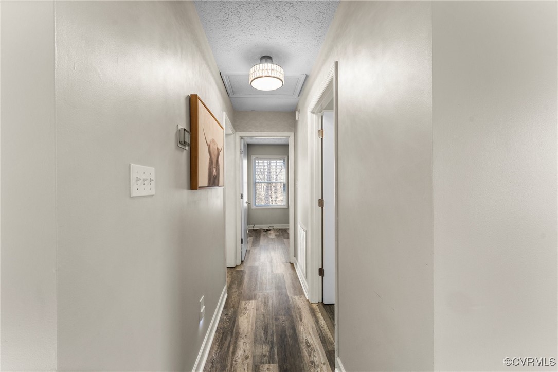 3840 Cabin Road Gum Spring, VA 23065 - Photo 15 of 42 a view of a hallway with wooden floor
