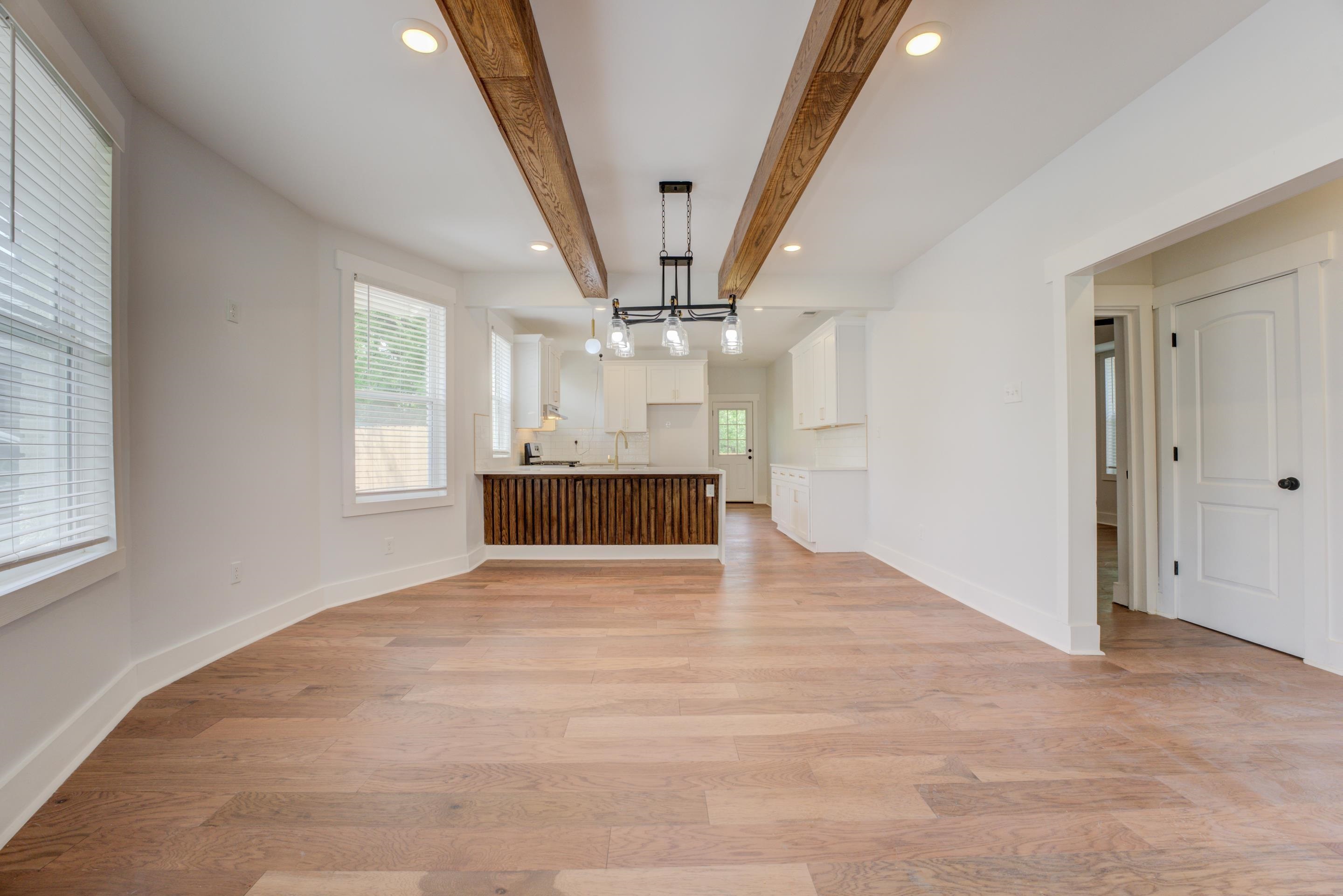 857 E Parkway South Memphis, TN 38104 - Photo 11 of 30 an empty room with wooden floor and windows