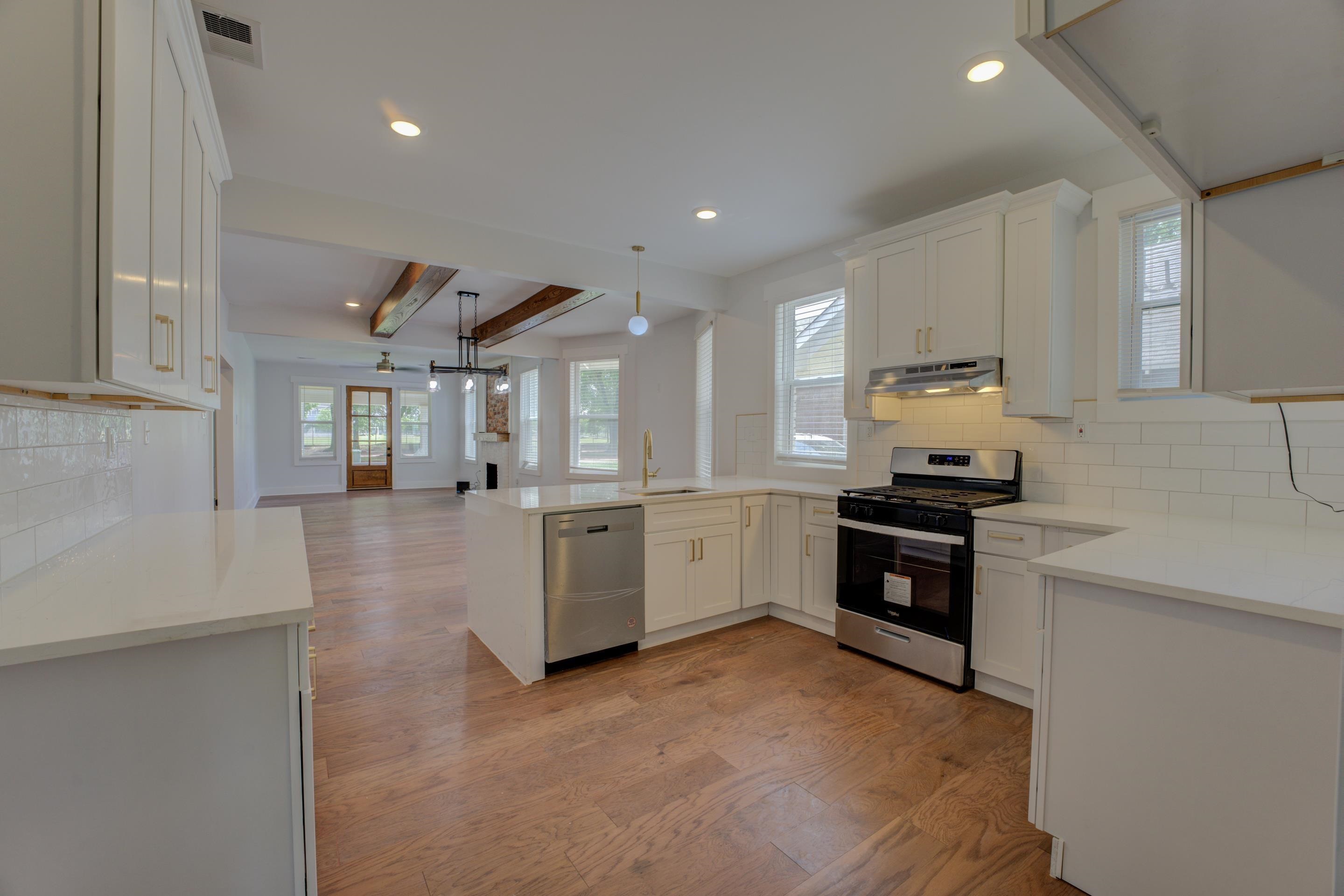 857 E Parkway South Memphis, TN 38104 - Photo 15 of 30 a large white kitchen with stainless steel appliances