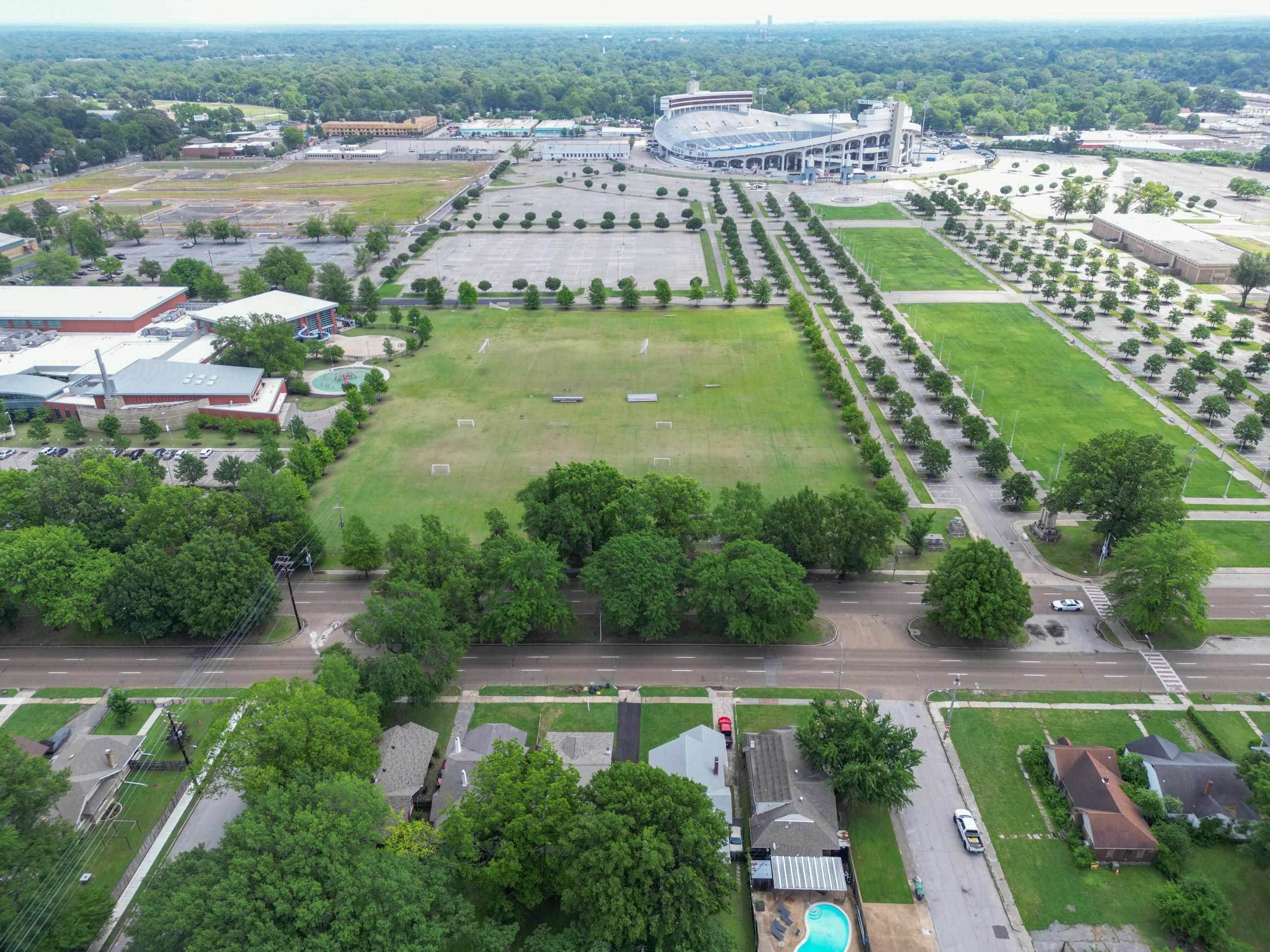 857 E Parkway South Memphis, TN 38104 - Photo 22 of 30 an aerial view of residential houses with outdoor space and swimming pool
