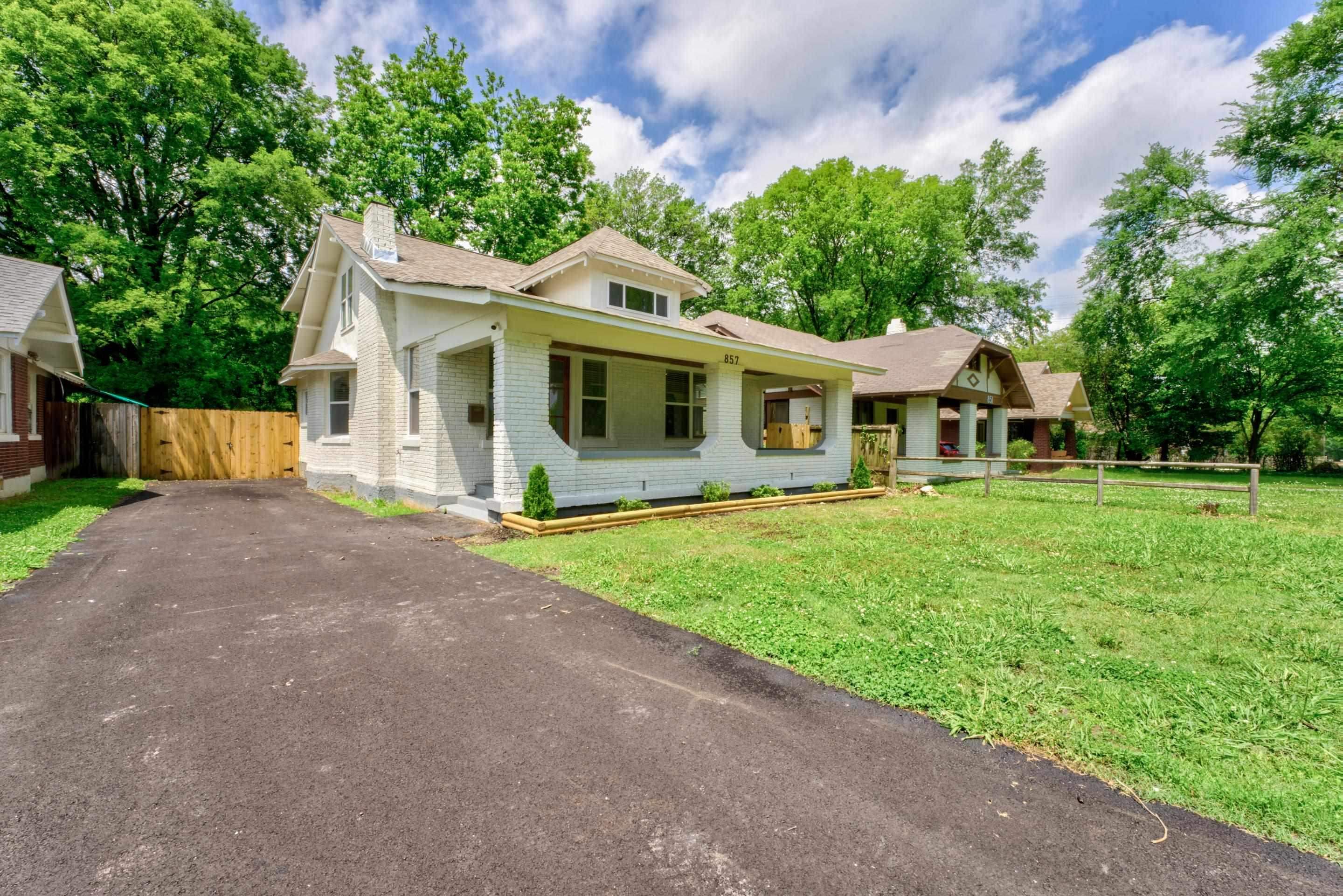 857 E Parkway South Memphis, TN 38104 - Photo 27 of 30 a front view of a house with a yard and trees