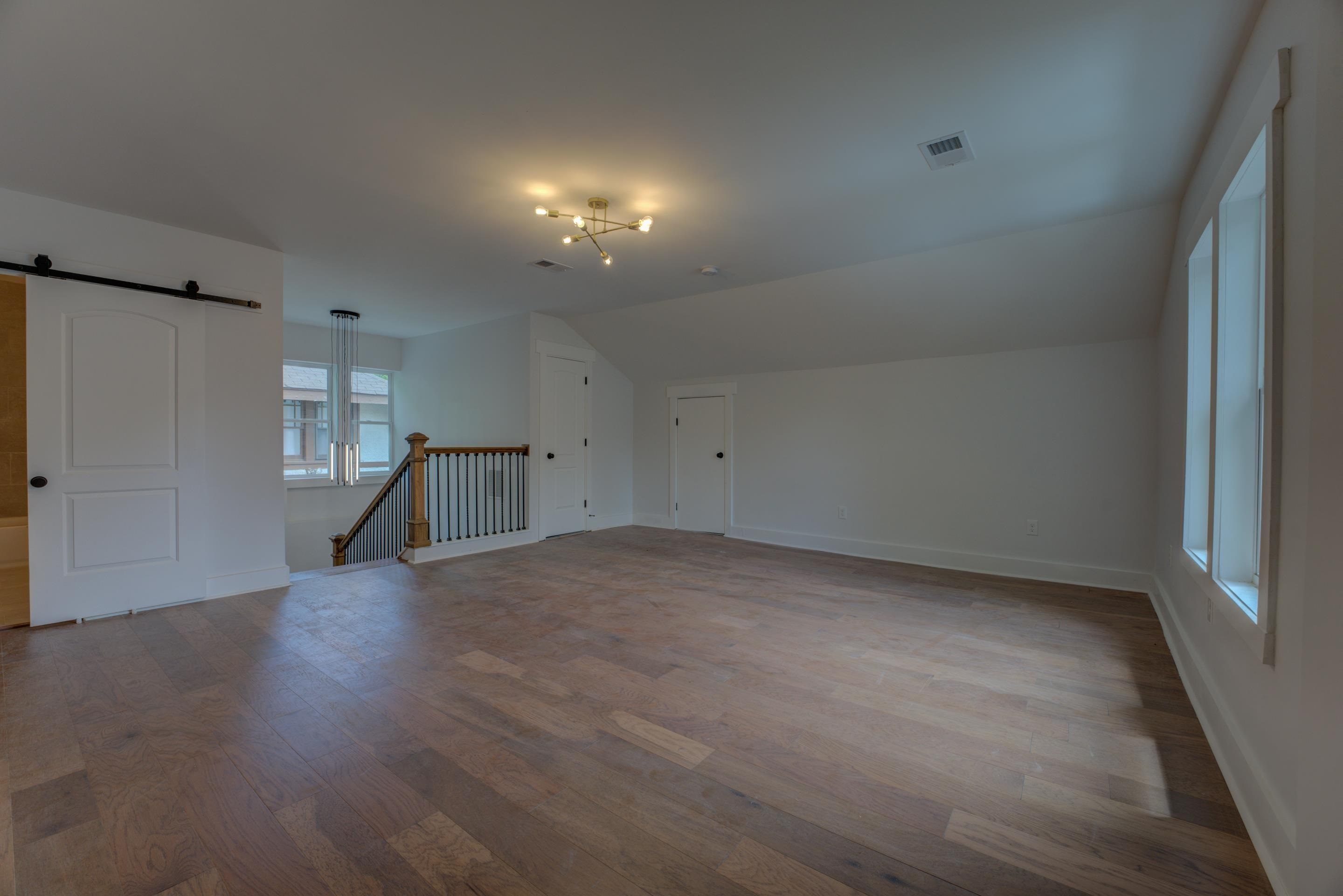 857 E Parkway South Memphis, TN 38104 - Photo 29 of 30 an empty room with wooden floor and windows