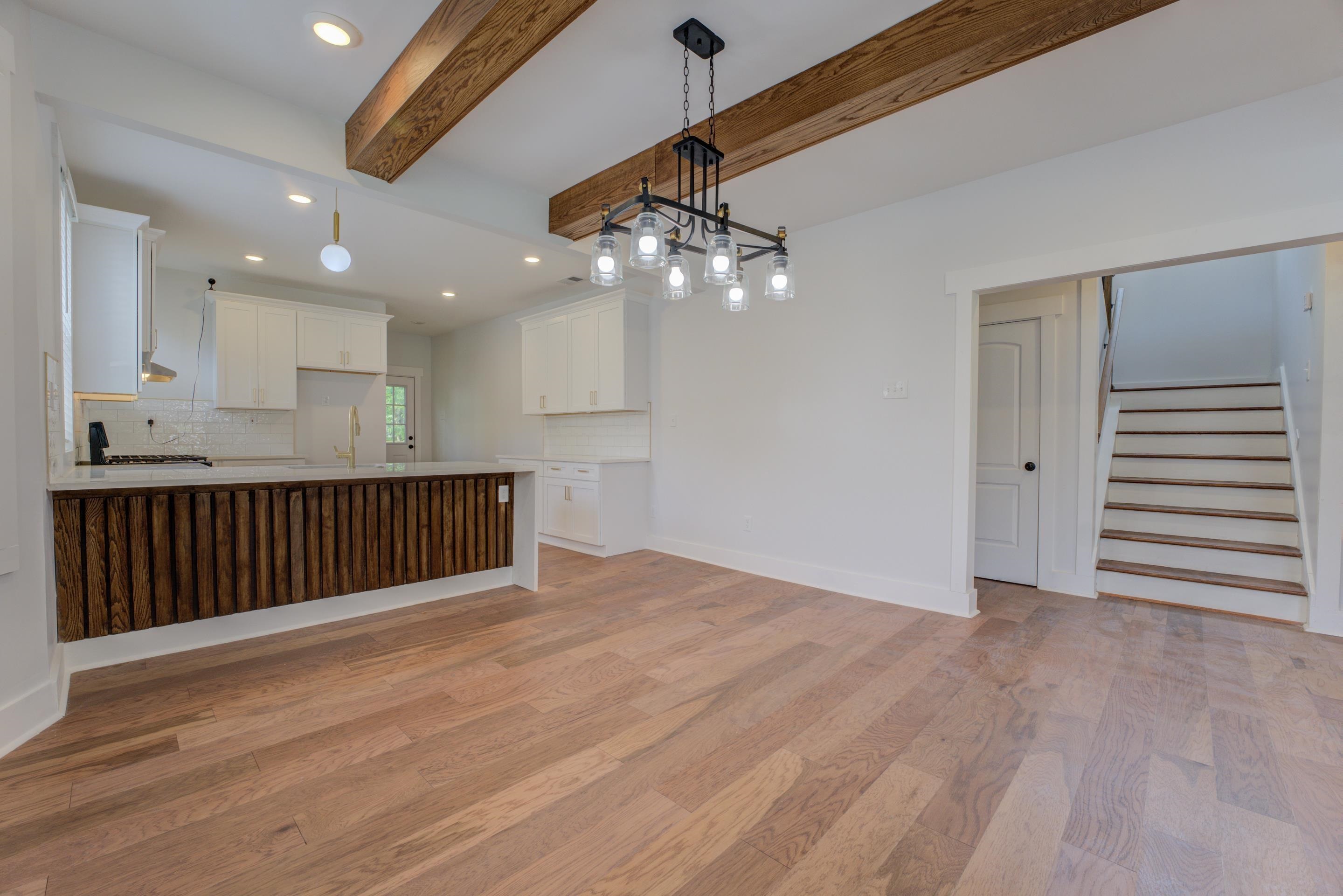 857 E Parkway South Memphis, TN 38104 - Photo 3 of 30 a view of an empty room with wooden floor and fan
