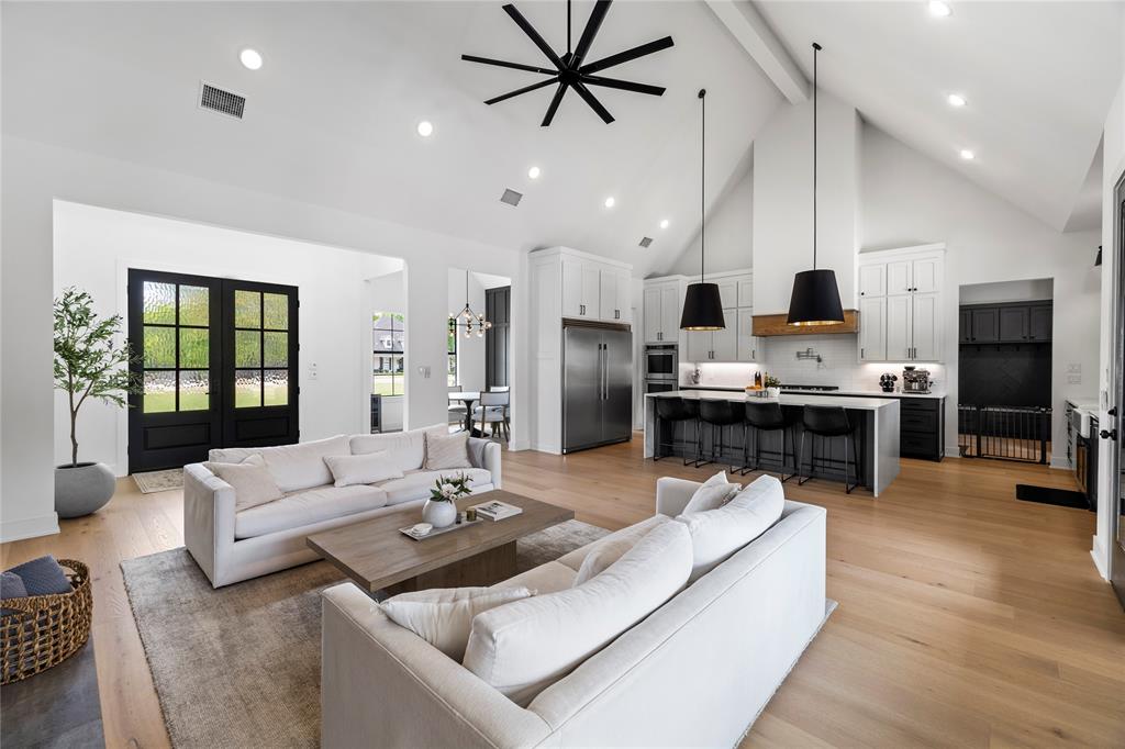 21197 Gatlinburg Road Bullard, TX 75757 - Photo 11 of 40 a living room with stainless steel appliances kitchen island granite countertop furniture and a view of kitchen